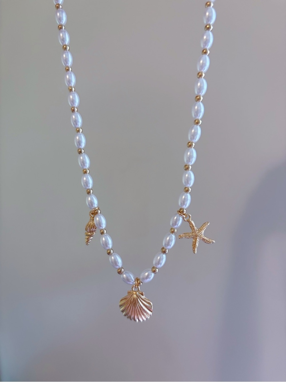 Hand Crafted White Pearl Necklace with Gold Seashell & Starfish Charms